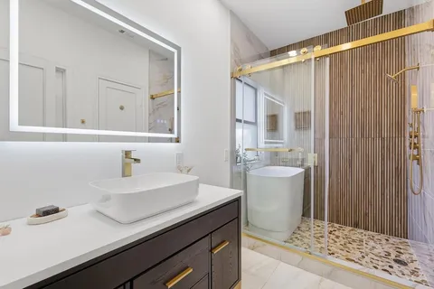 a bathroom with a sink and a mirror
