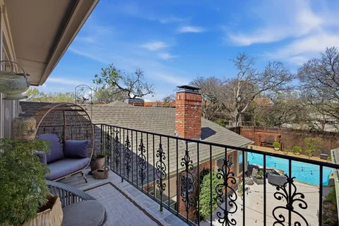 a view of balcony with furniture