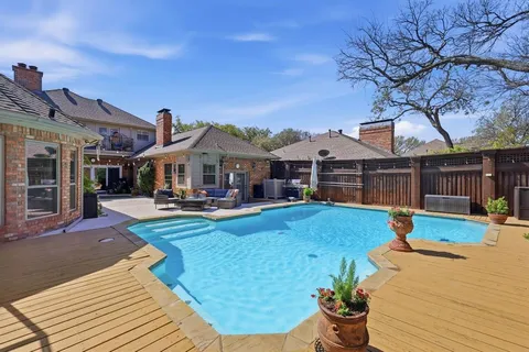 a front view of a house with yard table and chairs