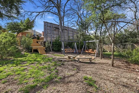 a view of a bench in a backyard