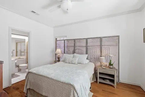a bedroom with a bed and a table