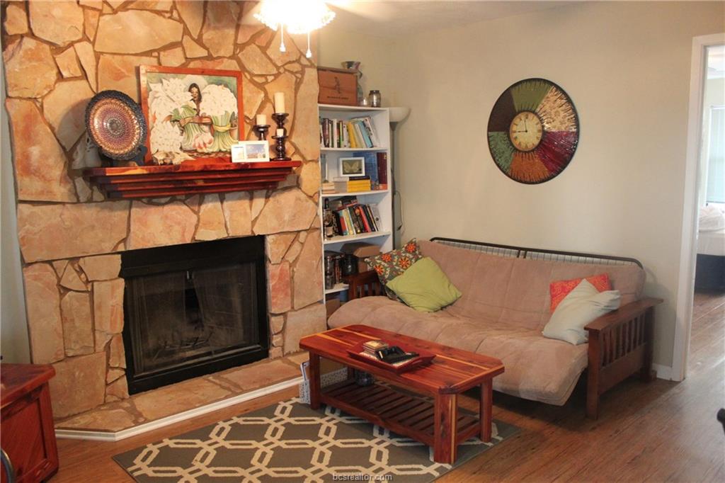 4441 Old College Road, Unit 3104 Bryan, TX 77801 - Photo 2 of 6 a living room with furniture and a fireplace