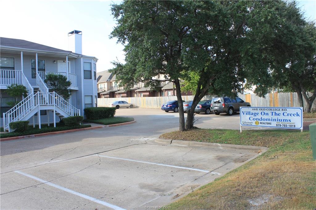 4441 Old College Road, Unit 3104 Bryan, TX 77801 - Photo 6 of 6 a view of street with a building and trees in the background