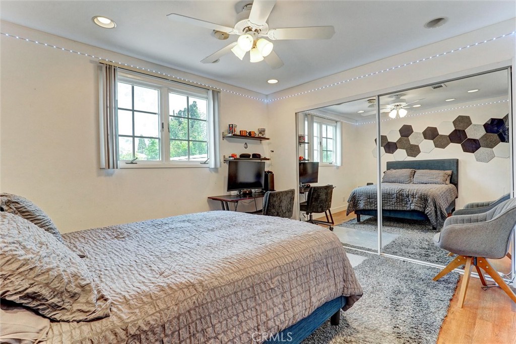 19238 Castlebay Lane Porter Ranch, CA 91326 - Photo 28 of 38 a bedroom with furniture and a chandelier