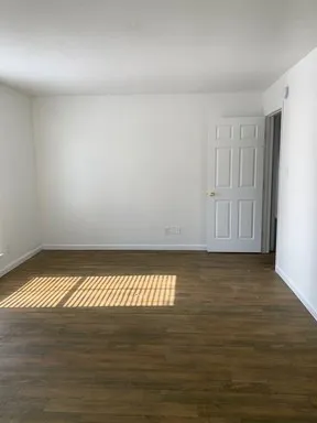 a view of an empty room and window