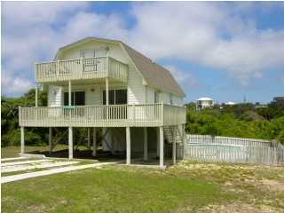 6050 Hwy Santa Rosa Beach, Unit 30A Santa Rosa Beach, FL 32459 - Photo 1 of 23 a front view of a house with a yard