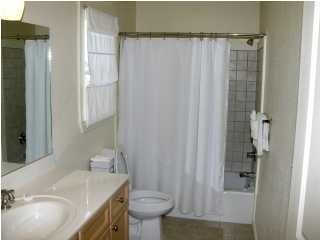 6050 Hwy Santa Rosa Beach, Unit 30A Santa Rosa Beach, FL 32459 - Photo 11 of 23 a bathroom with a sink and a mirror
