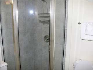 6050 Hwy Santa Rosa Beach, Unit 30A Santa Rosa Beach, FL 32459 - Photo 16 of 23 a bathroom with a glass shower door