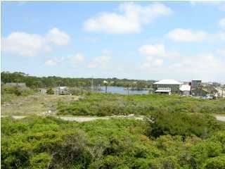 6050 Hwy Santa Rosa Beach, Unit 30A Santa Rosa Beach, FL 32459 - Photo 21 of 23 a view of a lake with houses in the back