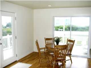 6050 Hwy Santa Rosa Beach, Unit 30A Santa Rosa Beach, FL 32459 - Photo 7 of 23 a view of a dining room with furniture and wooden floor