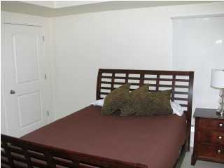 6050 Hwy Santa Rosa Beach, Unit 30A Santa Rosa Beach, FL 32459 - Photo 10 of 23 a bed sitting in a bedroom next to a window
