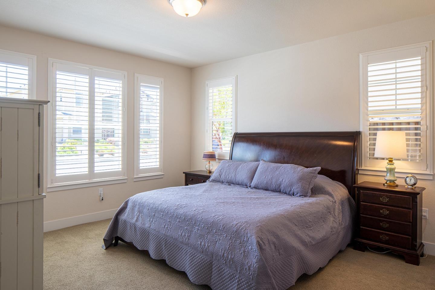 14741 Kit Carson Drive East Garrison, CA 93933 - Photo 11 of 24 a bedroom with a bed and a window