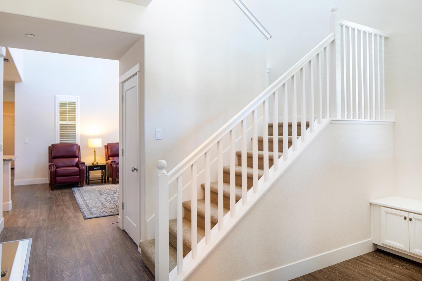 14741 Kit Carson Drive East Garrison, CA 93933 - Photo 15 of 24 a view of staircase with wooden floor and chair