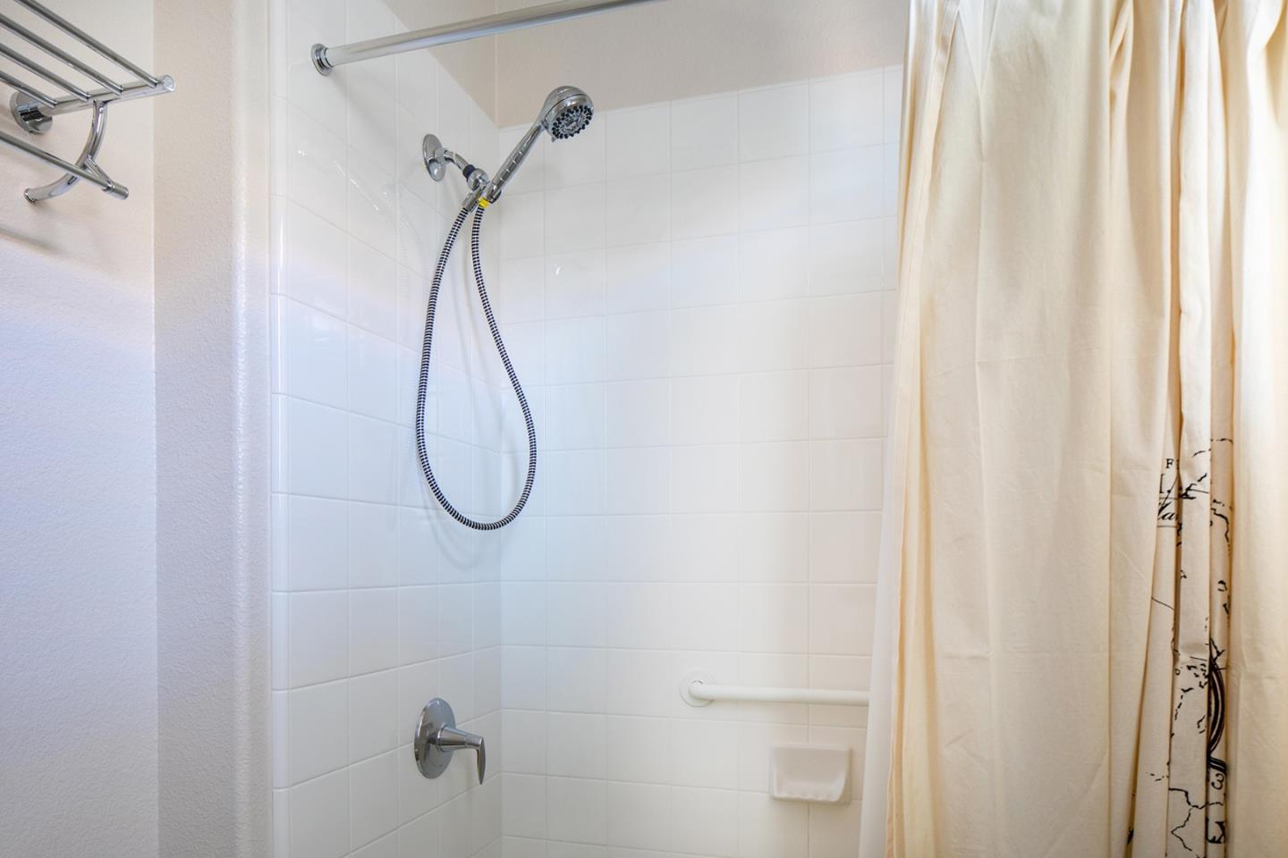 14741 Kit Carson Drive East Garrison, CA 93933 - Photo 19 of 24 a bathroom with a glass shower door