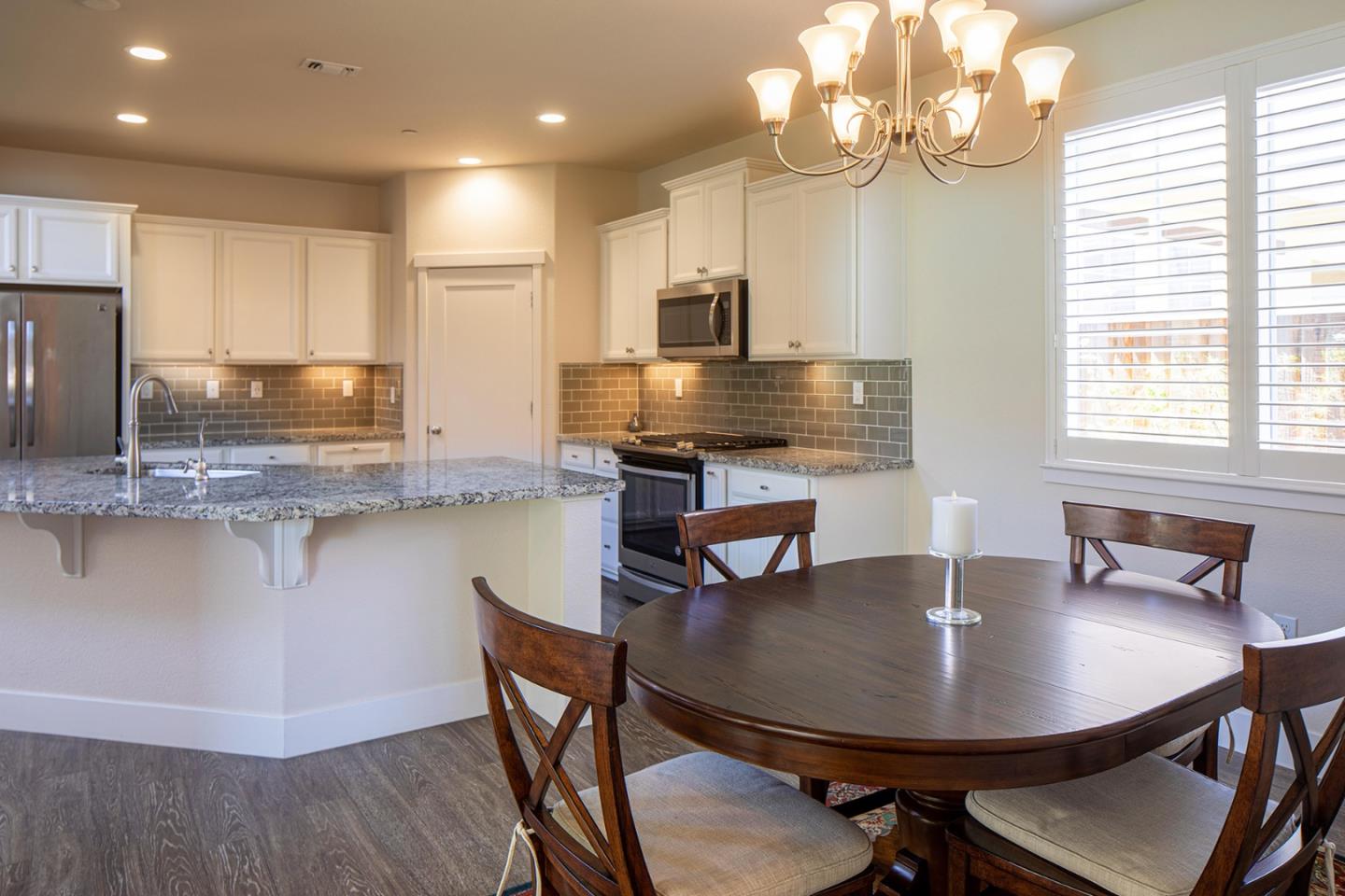 14741 Kit Carson Drive East Garrison, CA 93933 - Photo 9 of 24 a view of a dining room with furniture window and wooden floor