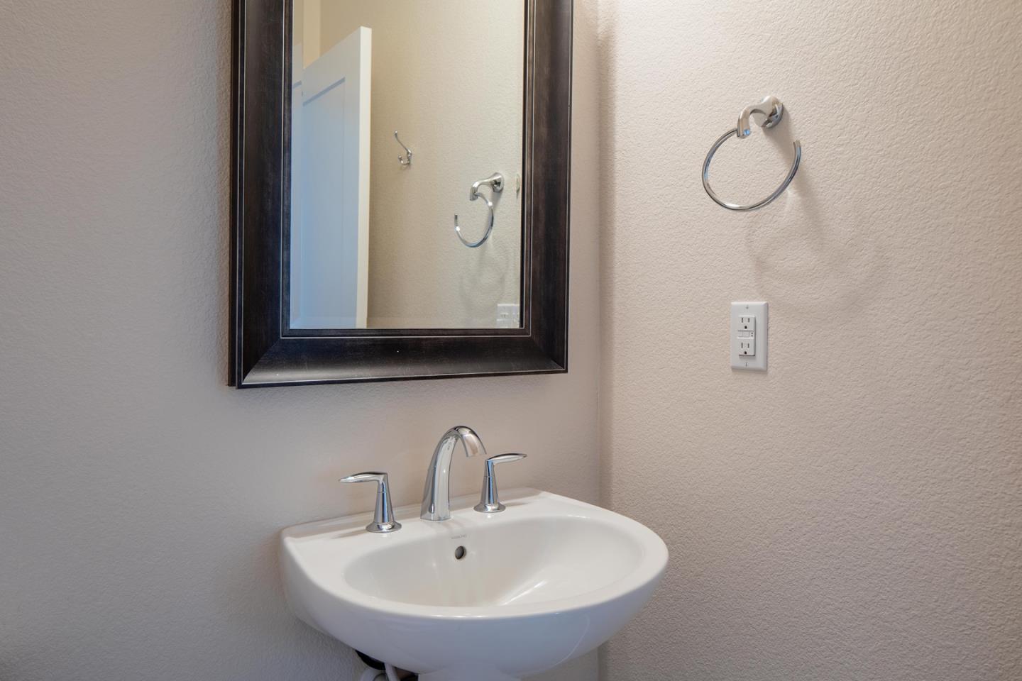 14741 Kit Carson Drive East Garrison, CA 93933 - Photo 10 of 24 a bathroom with a sink and mirror
