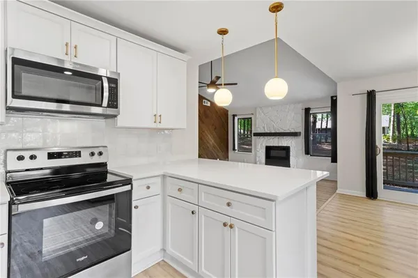 a kitchen with a stove and a microwave
