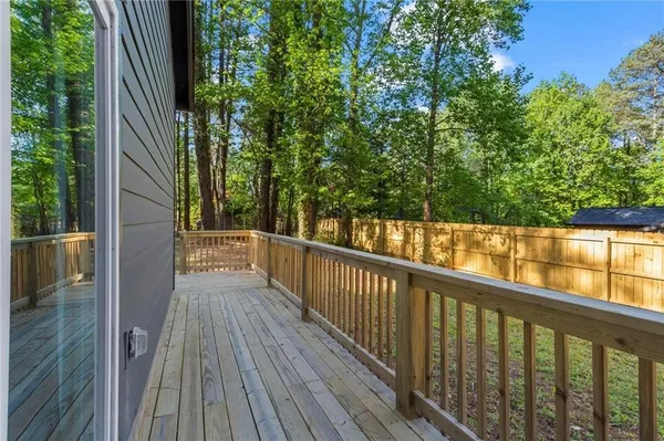 a view of balcony with wooden floor