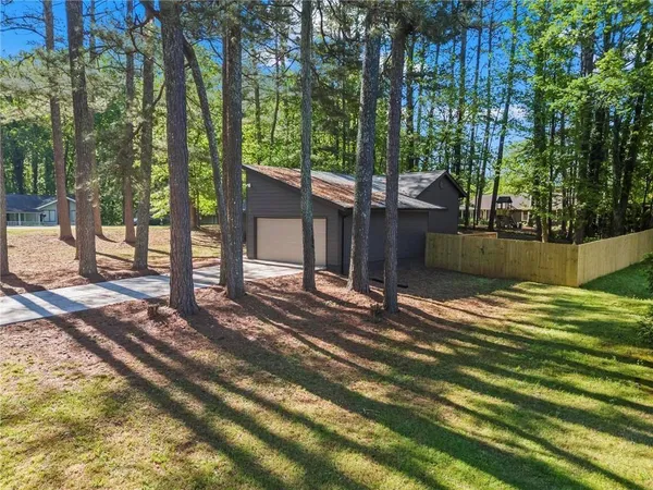 a view of a backyard of the house