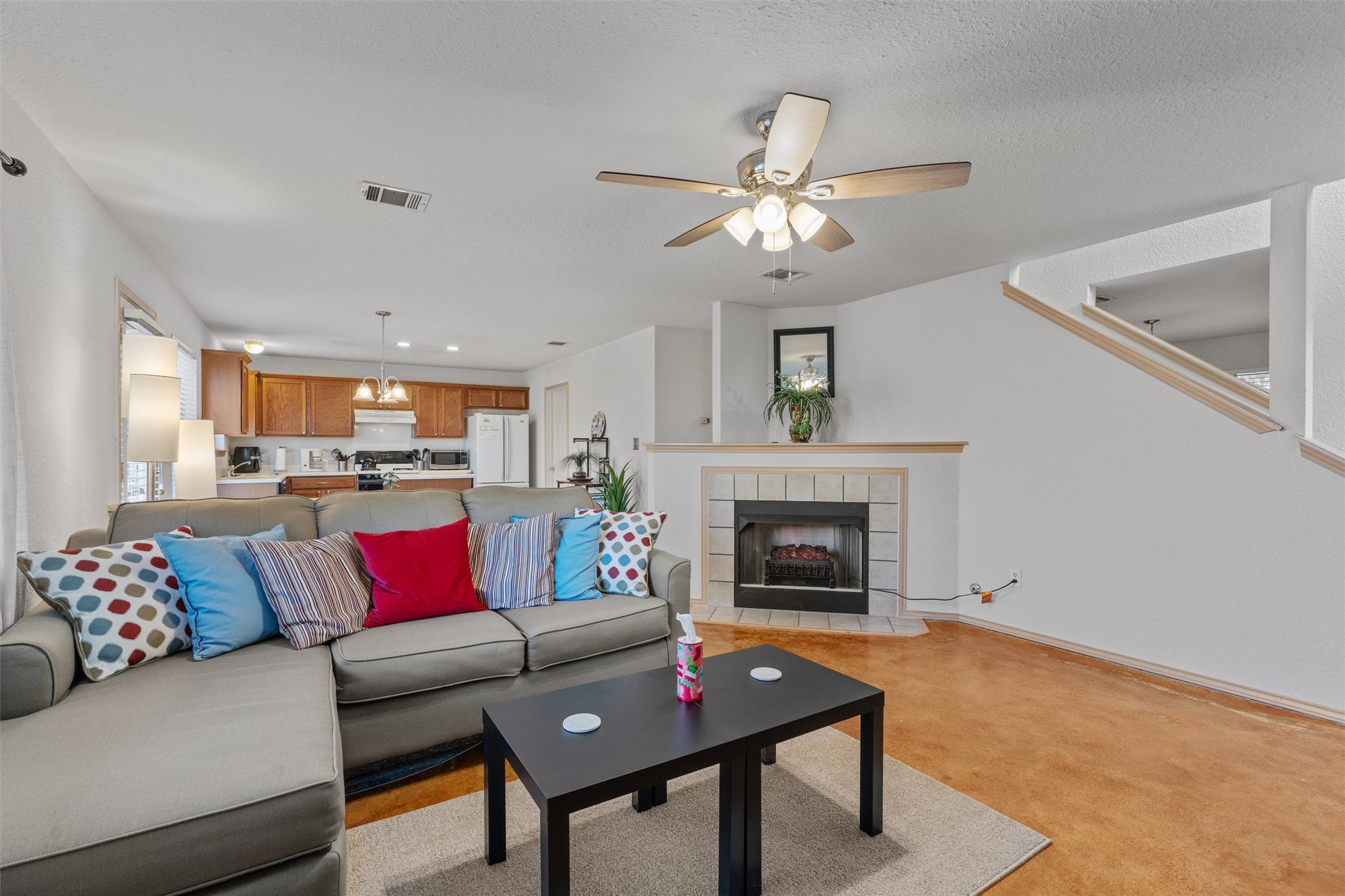 15419 Craig's Crest Path Pflugerville, TX 78660 - Photo 11 of 36 a living room with furniture and a fireplace