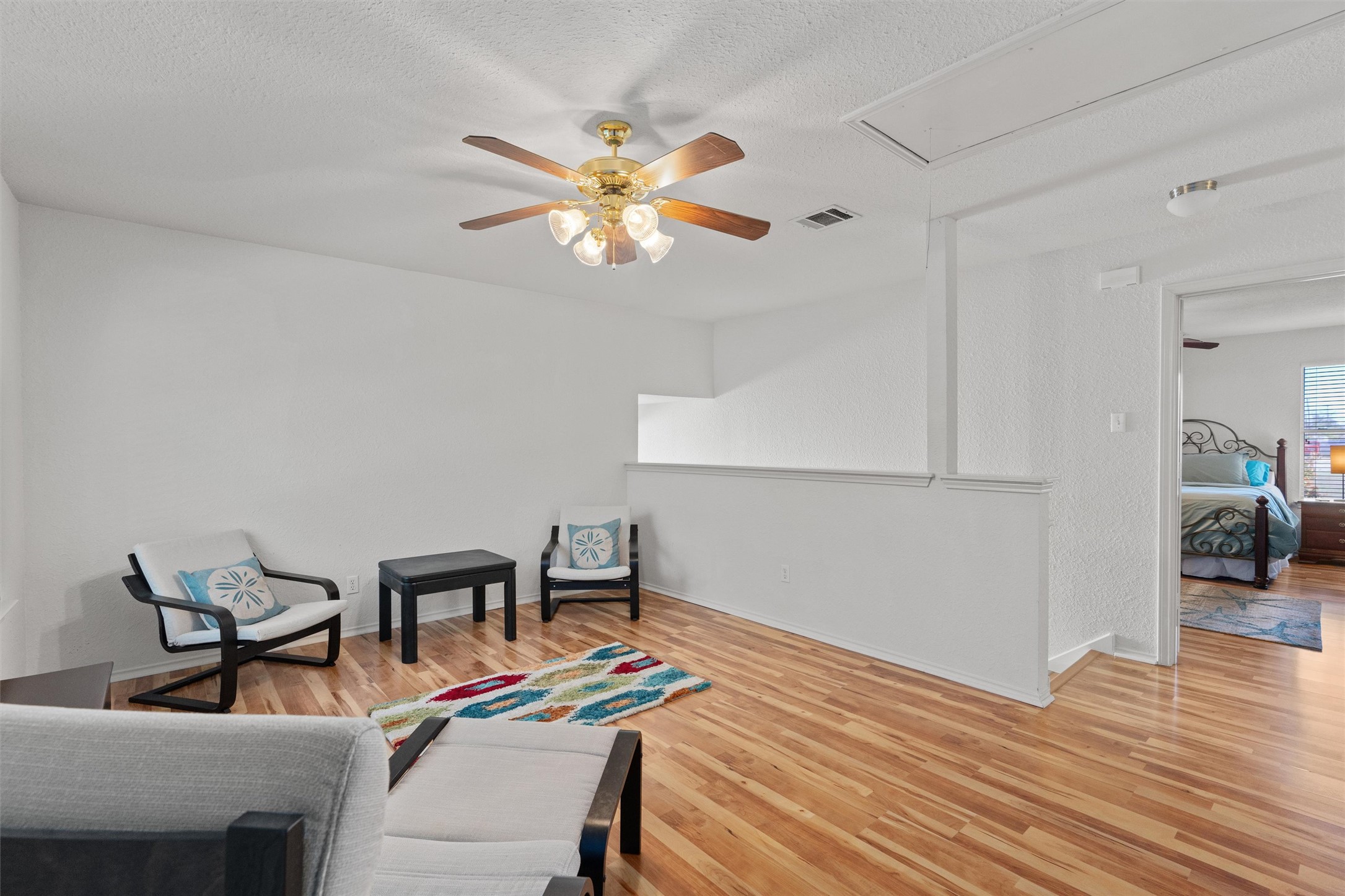 15419 Craig's Crest Path Pflugerville, TX 78660 - Photo 20 of 36 a bedroom with a bed and a chandelier