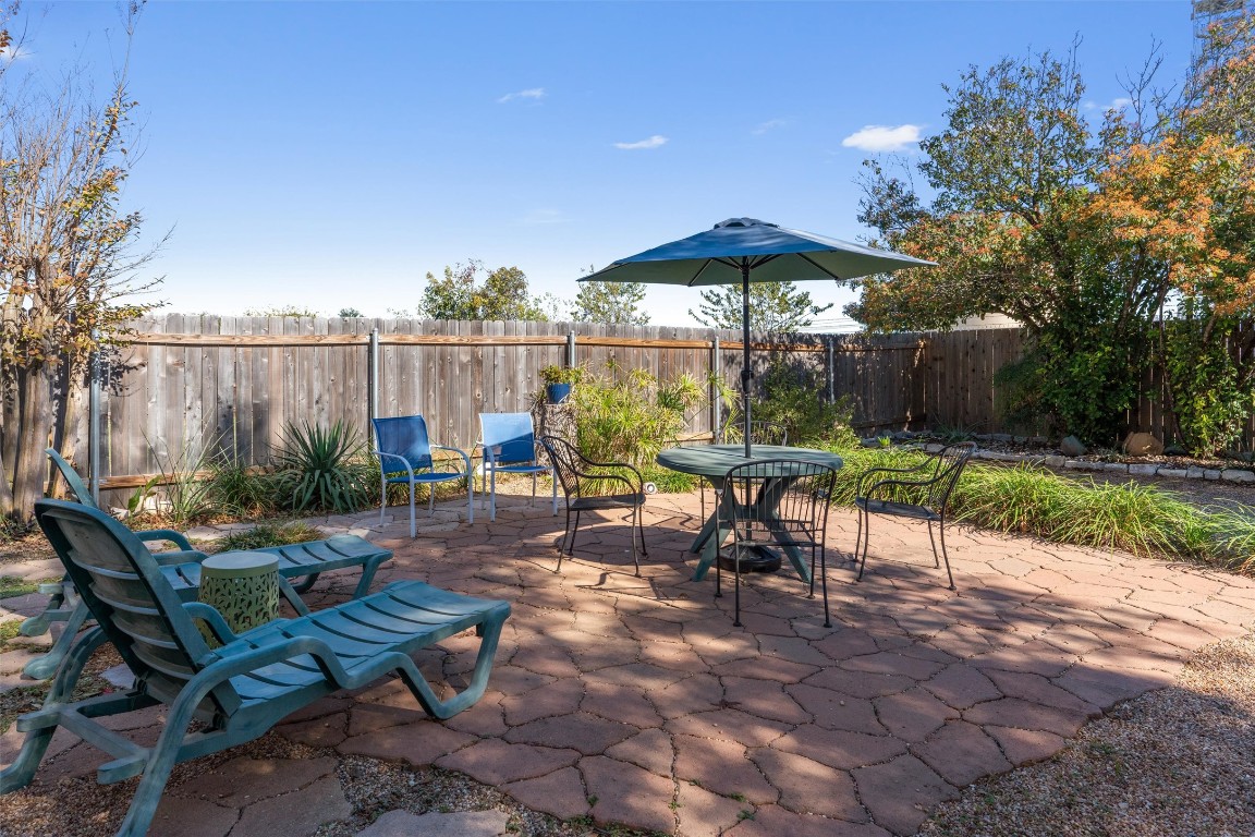 15419 Craig's Crest Path Pflugerville, TX 78660 - Photo 2 of 36 an outdoor sitting area with furniture and a garden