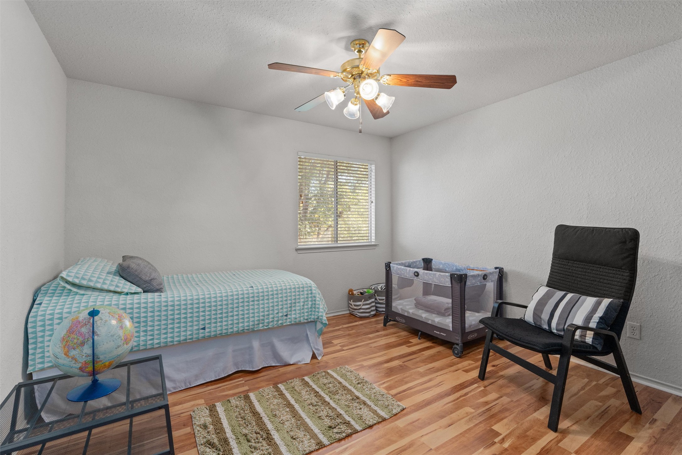 15419 Craig's Crest Path Pflugerville, TX 78660 - Photo 30 of 36 a bedroom with furniture and wooden floor