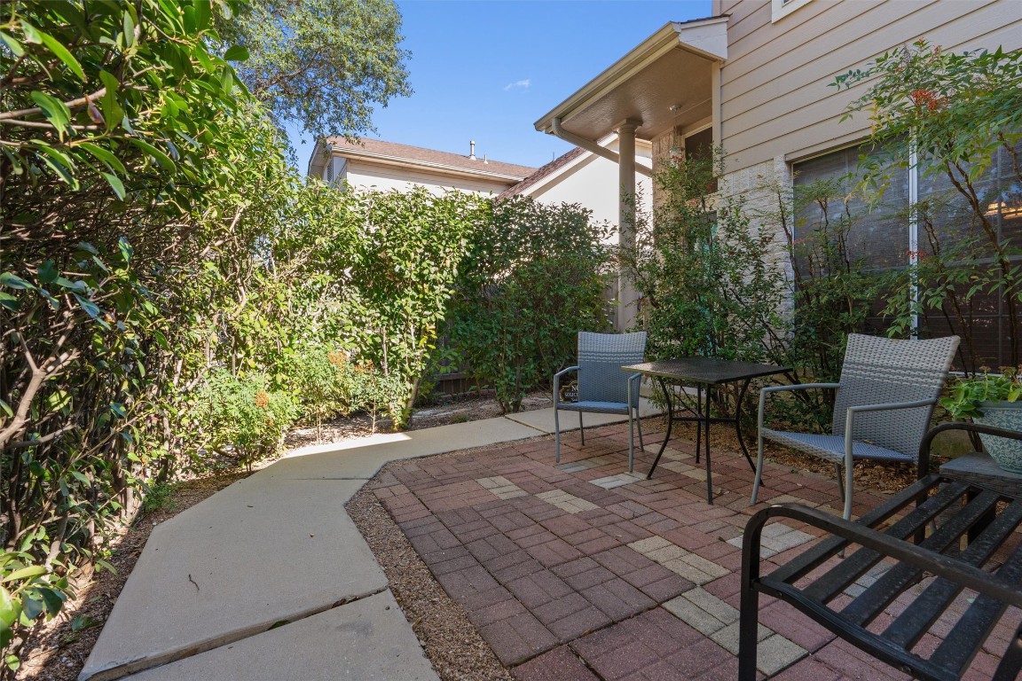 15419 Craig's Crest Path Pflugerville, TX 78660 - Photo 5 of 36 a view of a patio with table and chairs and potted plants