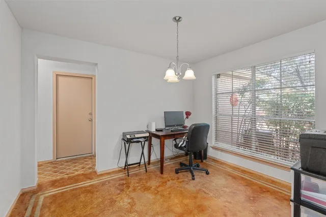 a workspace with furniture and a window