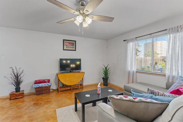 a living room with furniture and window