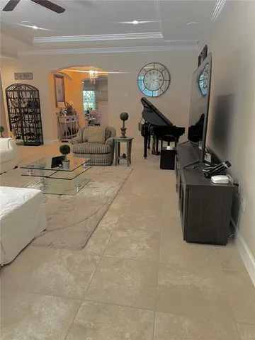 a bedroom with a bed and large window