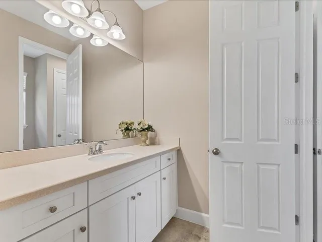 a view of swimming pool is middle in the garden