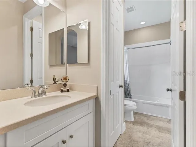 a view of a large trees with a lake