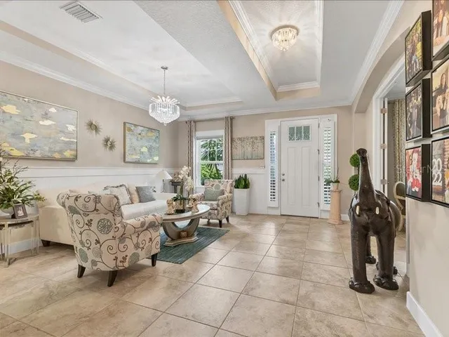 a dining room with furniture and window
