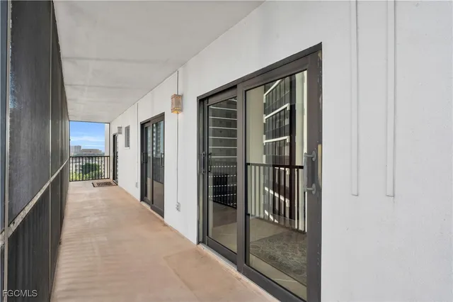 a balcony with furniture and wooden floor