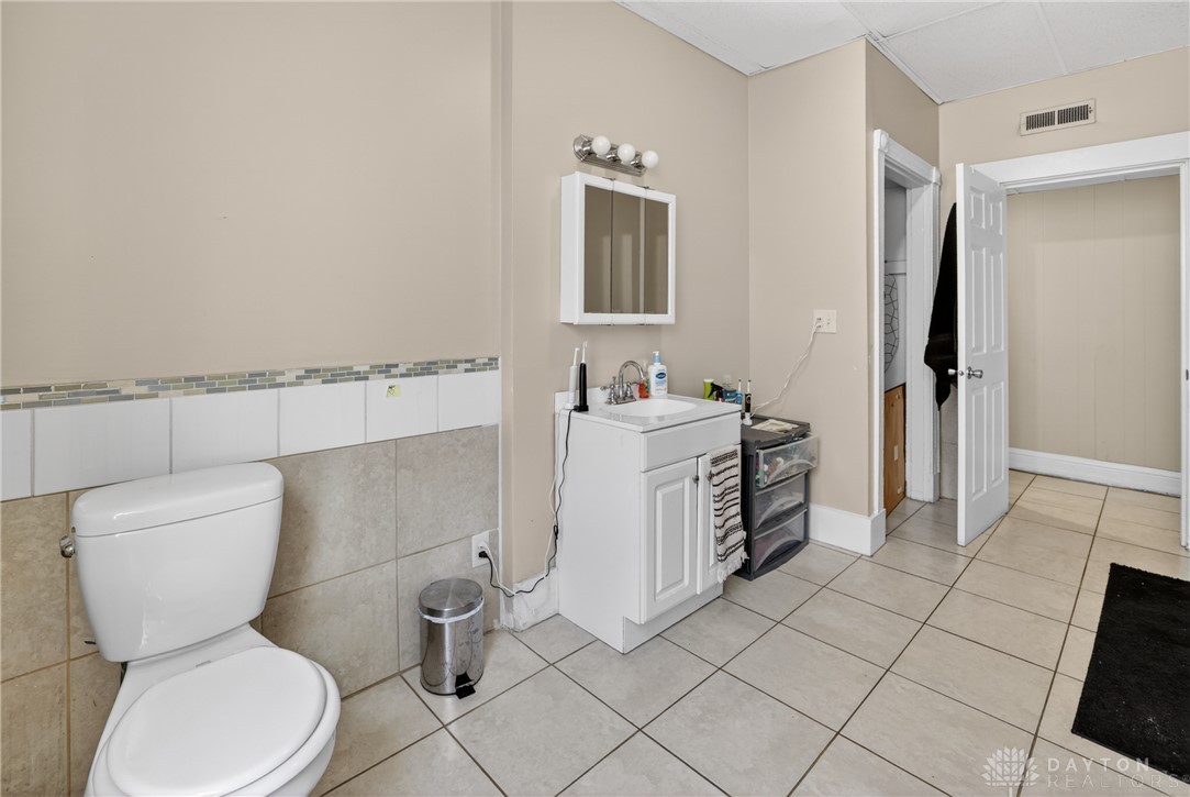 7045-7049 Montgomery Road Cincinnati, OH 45236 - Photo 35 of 68 This bathroom features durable tile flooring, a functional vanity, and convenient overhead lighting.