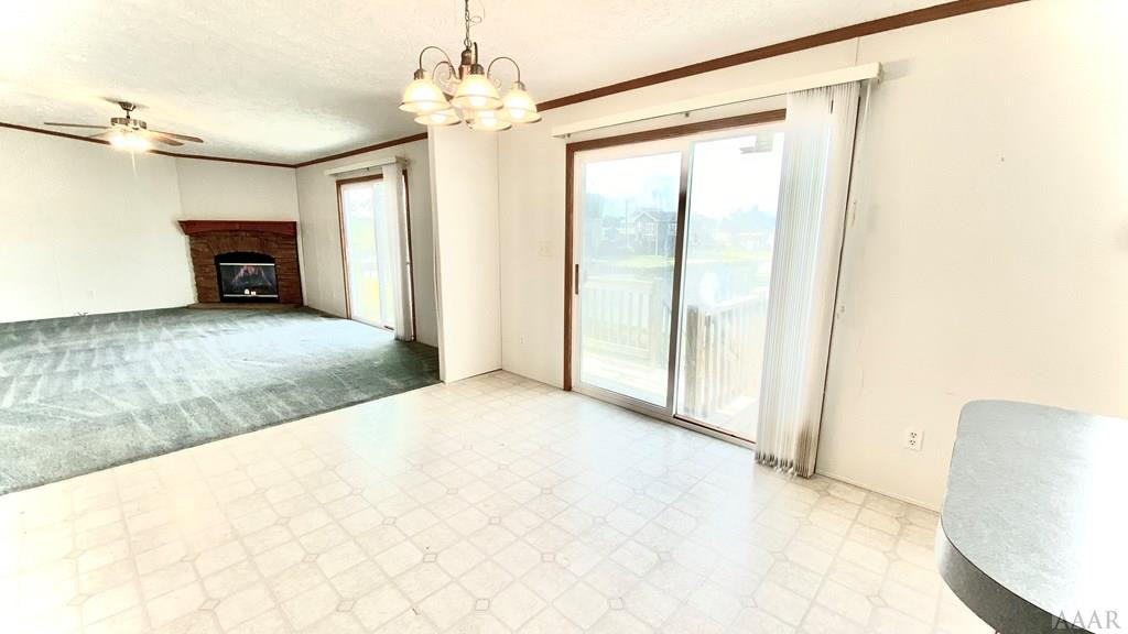 144 Inlet Lane Grandy, NC 27939 - Photo 11 of 27 View from kitchen into dining/den