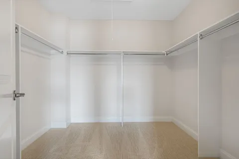 a view of an empty walk in closet