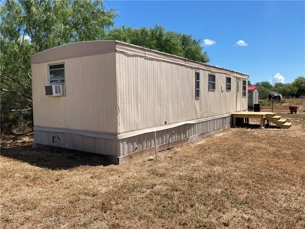 a view of a back yard of the house