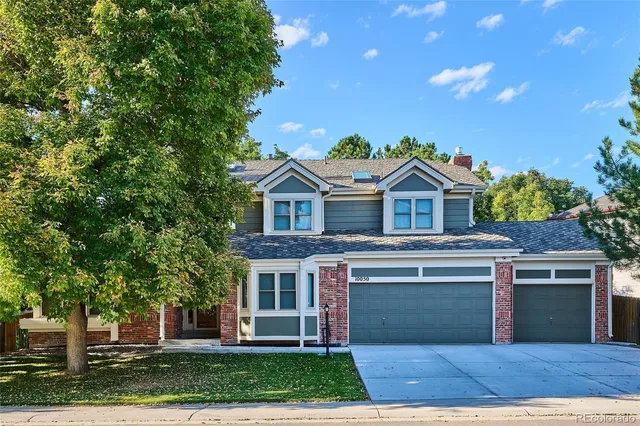 a view of house with outdoor space and street view