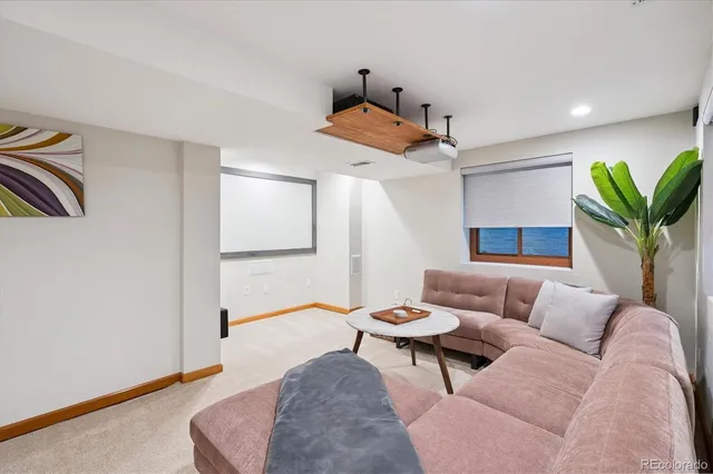 a living room with furniture and a rug