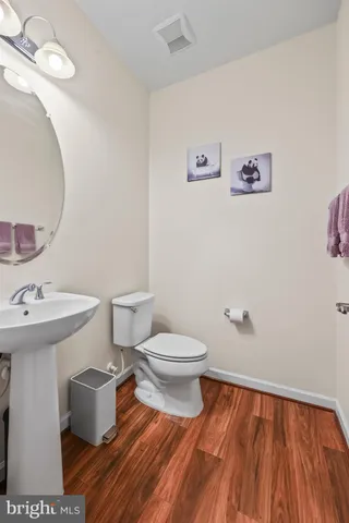 a view of staircase with white walls and a window