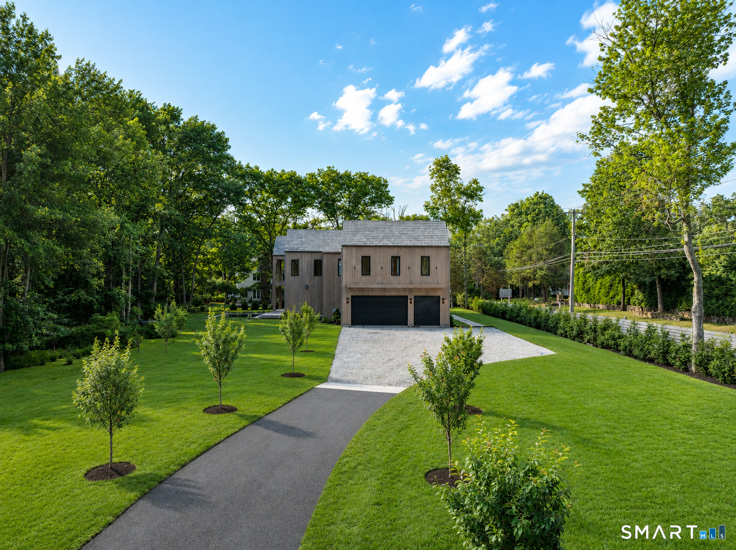 2 Windy Hill Road Westport, CT 06880 - Photo 3 of 40 a front view of a house with garden