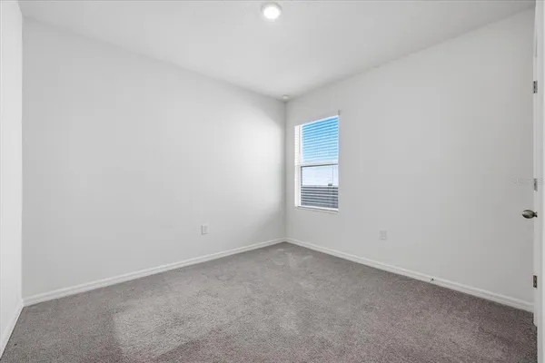 an empty room with a empty space and window
