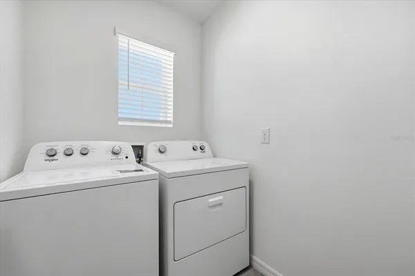 a utility room with dryer and washer