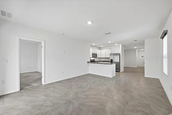 a view of kitchen cabinet and white cabinets