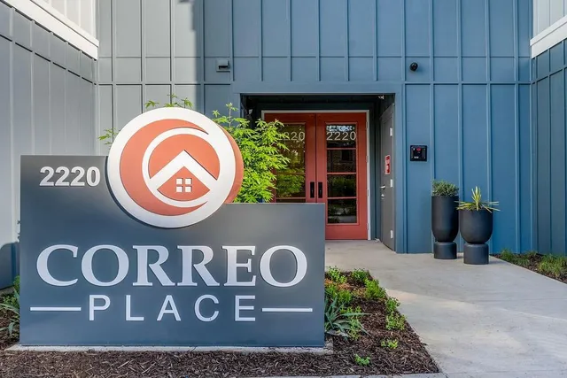 a sign that is on a brick wall