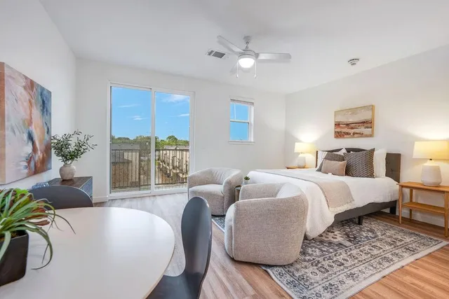 a bed room with a bed and a couch