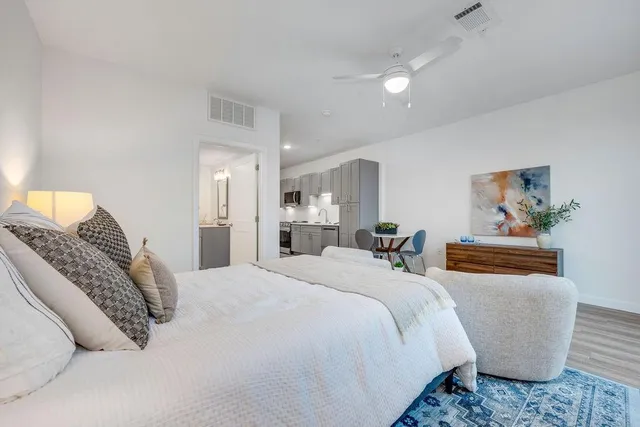 a bedroom with a bed and a couch