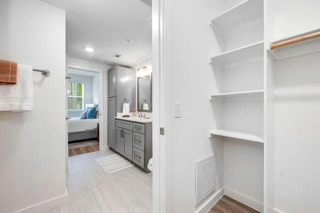 a living room with furniture and a dining table